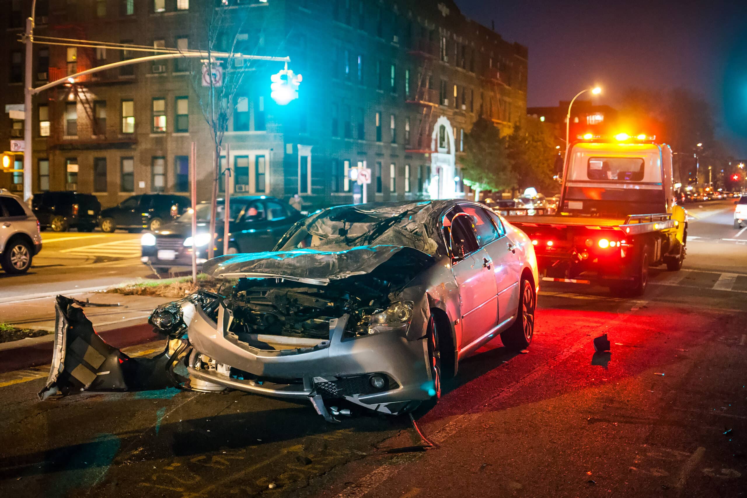 car accident where a silver car is destroyed.