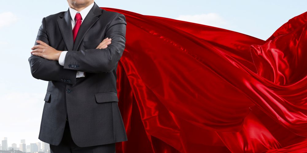 Lawyer in a suit with a red cape.
