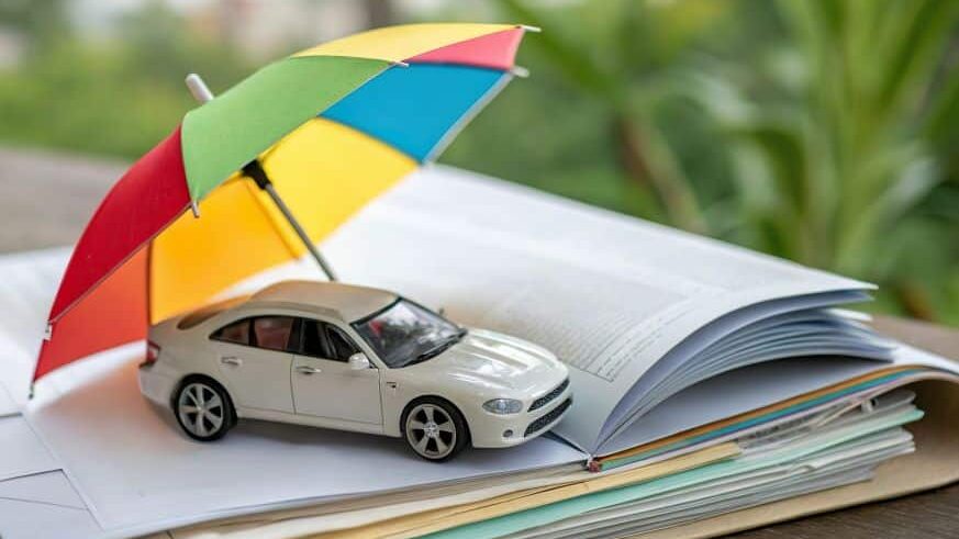 Umbrella covering car on stack of papers
