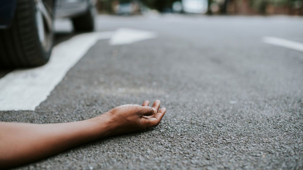Person in the road post pedestrian crash