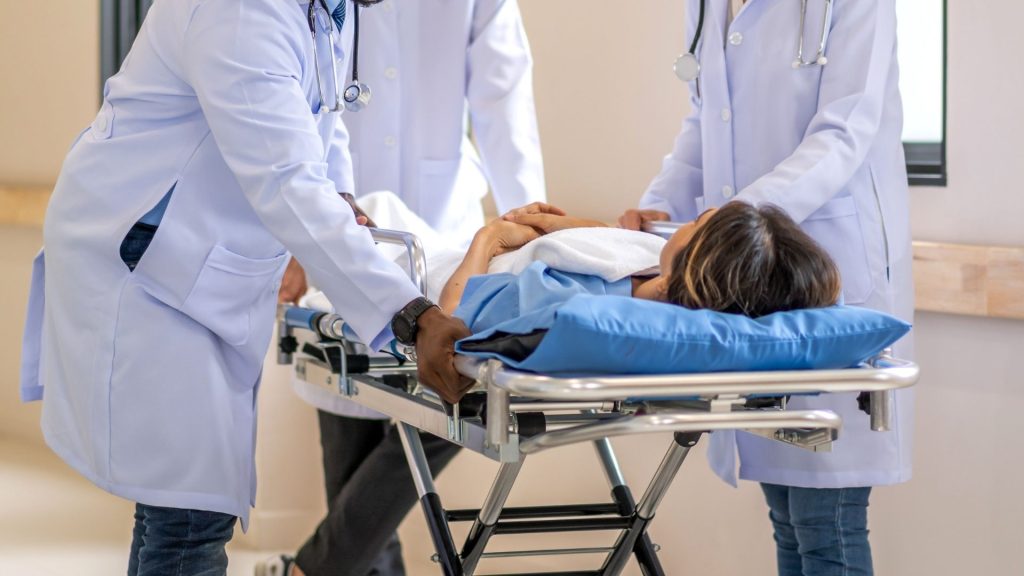 Woman Being Wheeled Into the Hospital